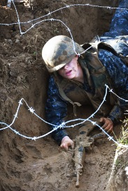 ANNAPOLIS, MD - May 16: A Naval Academy plebe goes through the trench area that is part of the "Wet and Sandy" portion of the annual Sea Trials at the United States Naval Academy on Tuesday May 16, 2017 in Annapolis, MD.