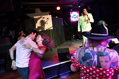 MEMPHIS, TN - AUGUST 14: Matt Joyce dances with Anne Kathrin to the music of Elvis Tribute Artist, Robert Washington while Amanda Dorrington, is seen at right at Blues City Band Box on Monday August 14, 2017 in Memphis, TN. August 11-19 is Elvis Week. This year marks the 40th year since Elvis Presley's death.