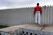 Elvis Tribute Artist, Jimmy Smith of Aiken, SC looks over a fence at Graceland from the backyard of Bud and Mary Stonebraker on Monday August 14, 2017 in Memphis, TN. The couple have lived directly behind Elvis Presley's Graceland for 22 years. Bud refers to he and his wife as more Elvis fanatics than just fans. Their house is decked out with Elvis memorabilia. They hosted free concerts in their backyard during Elvis Week.