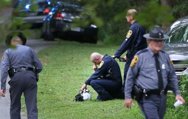 Authorities near the scene of the helicopter crash near Charlottesville on Saturday Aug. 12, 2017. Virginia State Police confirmed two deaths in the crash.