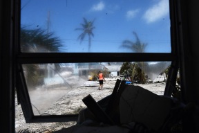 Ely Chavez works to clear debris from her home`following Hurricane Irma in the Tavernier area located in the Florida Keys on Tuesday September 12, 2017 in Tavernier, FL. The family was able to get back to see their home for the first time today. "Didn't expect it to be this bad", Ely's husband, Kevin said while referring to his home.