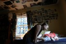 Maddie Ross, 28, plays with her son, Dexter, at her motherÕs home in her old room in South Roanoke after seven months in Bethany Hall - a residential substance abuse treatment program. Artwork, magazine clippings and photos of friends from high school hang on the walls. Ross was homeless, suicidal and thought she would die by age 27 from her alcohol and opiates addiction. The Roanoke Times followed Ross and another woman, Kyla Donoho, as they worked their way through the substance abuse treatment program. "I think it really took Dexter coming into my life to see the world in a better perspective," said Ross, who had been through multiple treatment programs and attributes her success to Bethany Hall, "In other programs you donÕt get the education you need or the time to fix your thinking."