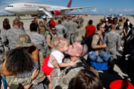 1st Place News: Jonathon Gruenke, Daily Press---Tech Sgt. Grant Kiekhaefer kisses his two-year-old daughter Kori Kiekhaefer during a homecoming ceremony at Langley Air Force Base Tuesday afternoon October 9, 2018. One hundred eighty-seven members of the 1st Fighter Wing returned home after a six month deployment in the Middle East.