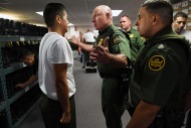 Edgar Delgado is talked to by instructor Roland Renaud while Delgado and other new trainees are fitted for uniforms, boots and hats at the United States Border Patrol Academy on Thursday August 30, 2018 in Artesia, NM. The academy is on the grounds of the Federal Law Enforcement Training Center.