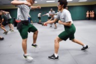 Felipe Chavez, left, jumps away from Silvia Gutierrez Gomez as they take part in edge weapons training at the United States Border Patrol Academy on Thursday August 30, 2018 in Artesia, NM. The academy is on the grounds of the Federal Law Enforcement Training Center.