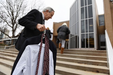 Gary Benjamin carries spare clothes for Ansly Damus after Gary and others rode a bus from Cleveland, OH in order to attend a hearing for Damus at the Ann Arbor Federal Building on Wednesday November 28, 2018 in Ann Arbor, MI. Damus, who is from Haiti has been detained since 2016 after coming to the United States to seek asylum. Ansly was released on Friday to live with Benjamin and his wife, Melody Hart.
