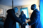 Gary Benjamin and his wife, Melody Hart pray with Ansly Damus as they stand in Ansly's room at their home on Friday November 30, 2018 in Cleveland Heights, OH. Damus, who is from Haiti has been detained since 2016 after coming to the United States to seek asylum. Ansly was released on Friday to live with Benjamin and Hart.