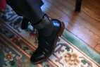 Ansly Damus wears an ankle monitor as he sits in the home of Gary Benjamin and his wife, Melody Hart on Friday November 30, 2018 in Cleveland Heights, OH. Damus, who is from Haiti has been detained since 2016 after coming to the United States to seek asylum. Ansly was released on Friday to live with Benjamin and Hart.