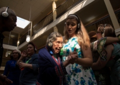 2nd Place Feature: Kaitlin McKeown, Virginian-Pilot---Norma Agee wears headphones while dancing with Kendall Ramirez, program director at Commonwealth Senior Living's Leigh Hall, during a "silent dance party" on Oct. 30, 2018 in Norfolk. Residents wore headphones designed to eliminate extraneous noise and help senior citizens with hearing loss.