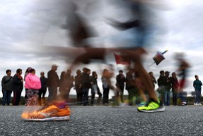 3rd Place Sports: Matt McClain, Washington Post---Runners are blurred while passing not far from the Lincoln Memorial during the annual Marine Corps Marathon on Sunday October 28, 2018 in Washington, DC.
