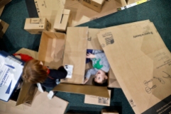 HM Feature: Jonathon Gruenke, Daily Press---Three-year-old Jonas Brin, center, plays in boxes at the Virginia Living Museum Monday during their Stellar Noon Year's Eve event December 31, 2018. The outer space themed event featured crafts, games, Star Wars characters and activities aimed at teaching to reduce environmental impact.